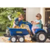 Leikkikaivuri Falk New Holland, sis. peräkärryn kipillä, sininen