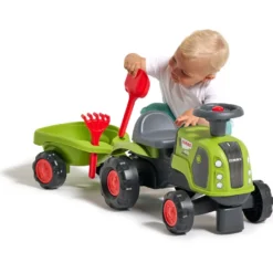 Potkutraktori Falk Claas, ohjauspyörä, äänimerkki ja työntökahva sekä perävaunu, lapio ja harava